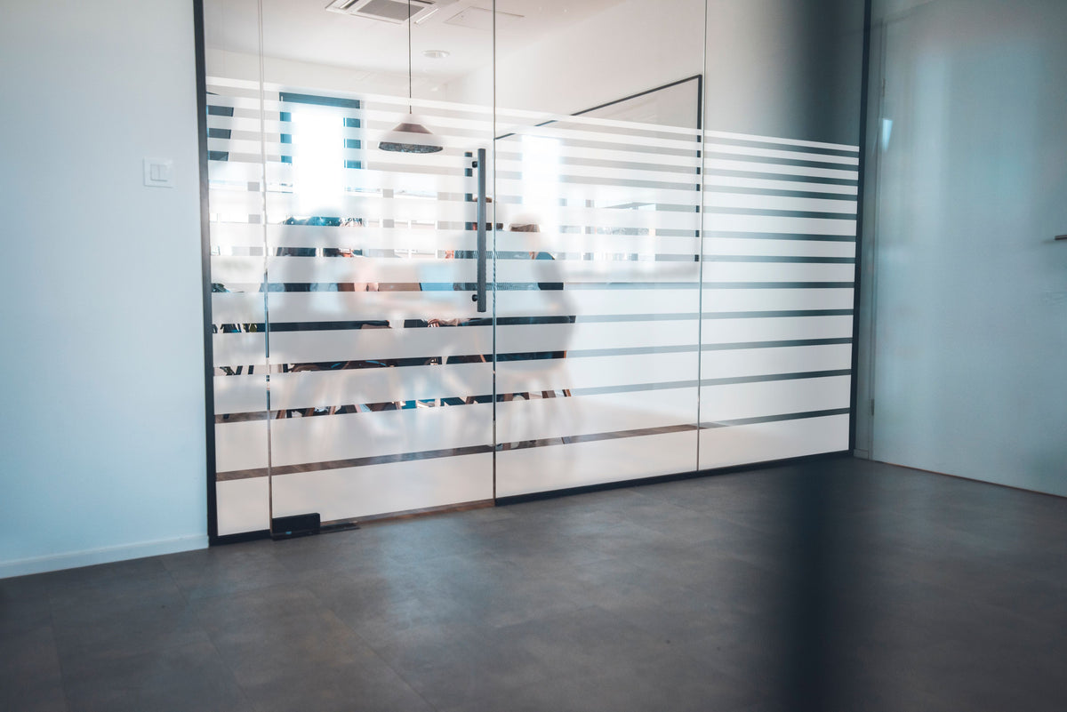 Lineal decorative window film installed on architectural glass in Dubai and Abu Dhabi